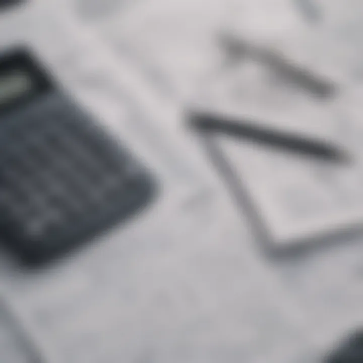 A close-up of a calculator and tax forms.